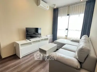 Modern living room with sleek furniture and natural light