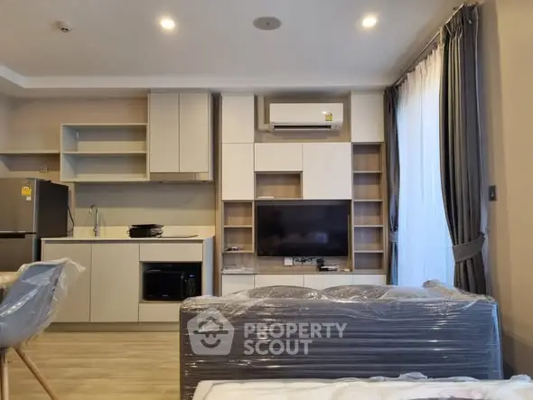 Modern living room with sleek furniture and built-in entertainment center