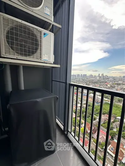 High-rise balcony with cityscape view and air conditioning units, perfect for urban living.