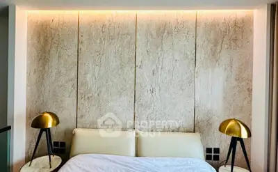 Luxurious bedroom with elegant lighting and modern decor