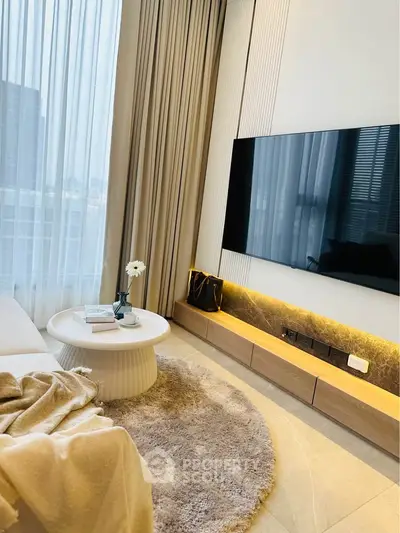 Luxurious modern living room with elegant decor and large TV