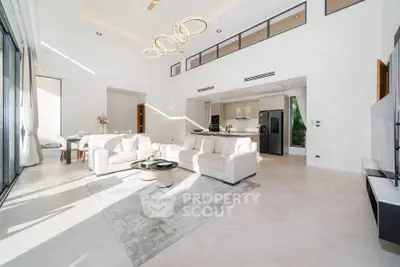 Luxurious open-plan living room with modern kitchen and elegant decor