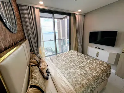 Luxurious bedroom with stunning ocean view and elegant decor