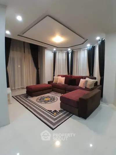 Elegant living room with modern decor and plush seating