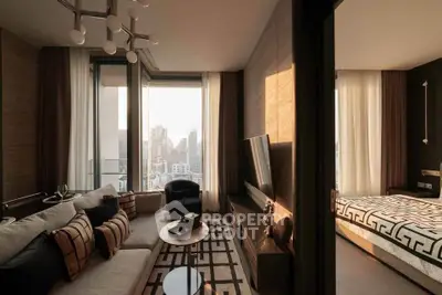 Luxurious modern living room with city view, elegant decor, and adjacent stylish bedroom.