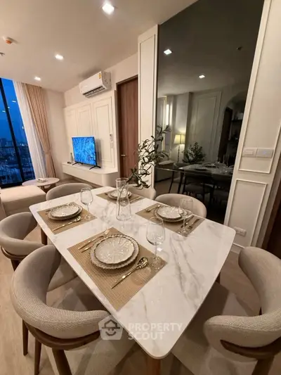 Elegant dining area with modern decor and city view, perfect for urban living.