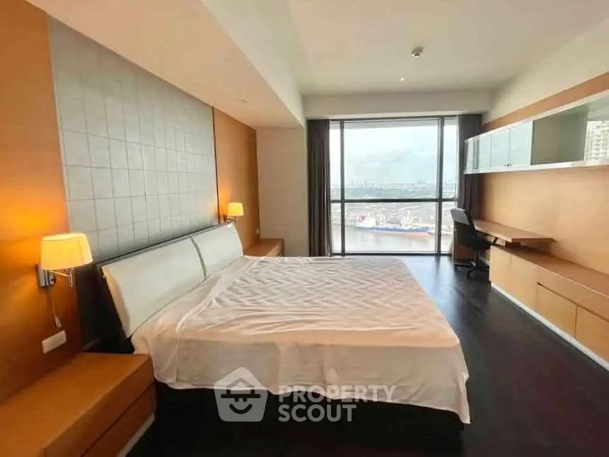 Spacious modern bedroom with city view and elegant furnishings