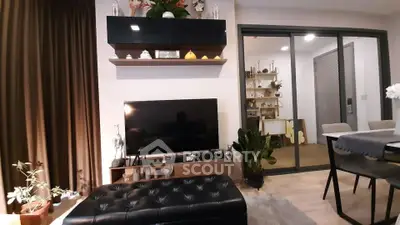 Modern living room with stylish decor and open dining area