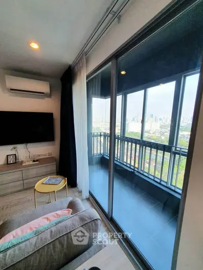 Modern living room with balcony view in high-rise apartment