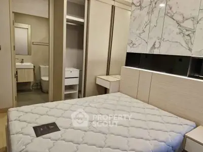 Modern bedroom with ensuite bathroom and stylish decor