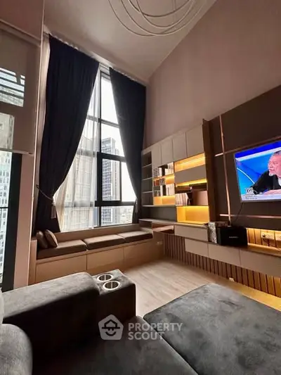 Luxurious living room with high ceilings and modern built-in shelving in a city apartment.