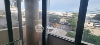 Spacious balcony with urban view in modern apartment building