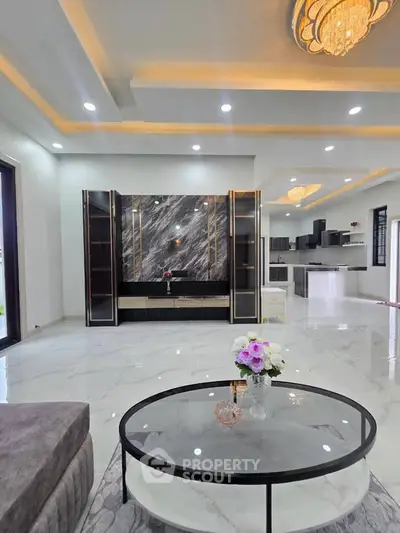 Luxurious modern living room with open kitchen and elegant marble accents