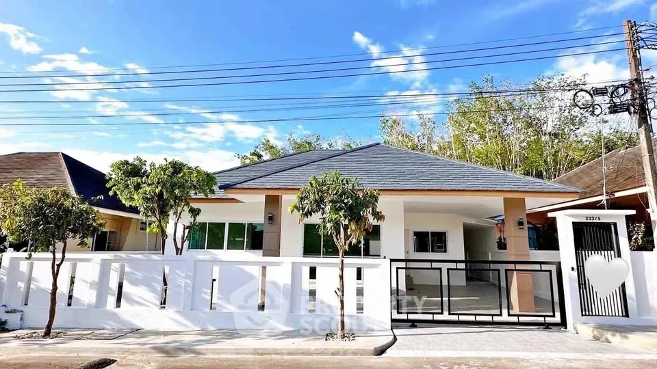 Charming single-story house with modern design and spacious front yard