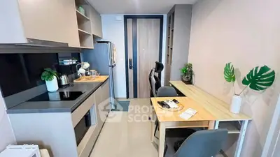 Modern compact kitchen with sleek design and integrated workspace, perfect for urban living.