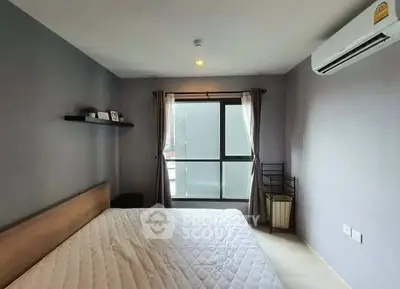 Modern bedroom with large window and air conditioning in stylish apartment