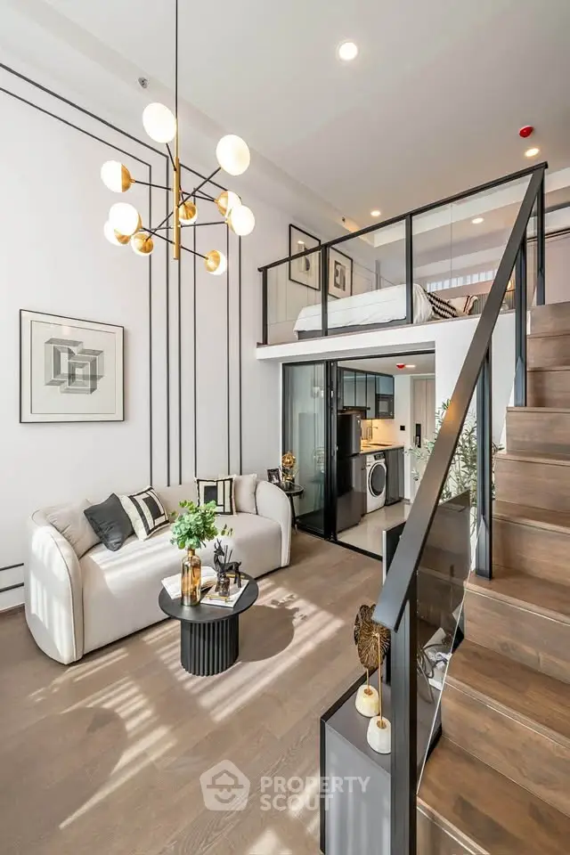Modern loft apartment with stylish living room and mezzanine bedroom, featuring elegant decor and open layout.