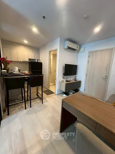 Modern studio apartment with open kitchen and cozy living area