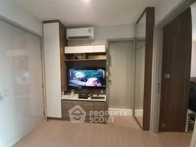 Modern living room with TV and air conditioning in stylish apartment