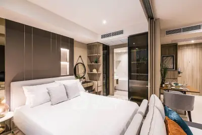 Luxurious modern bedroom with elegant decor and ensuite bathroom