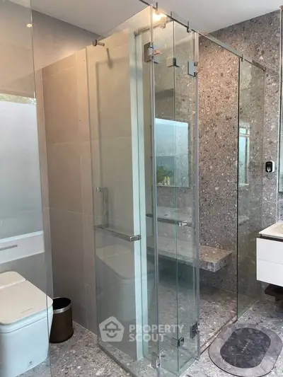 Modern bathroom with glass shower and sleek design