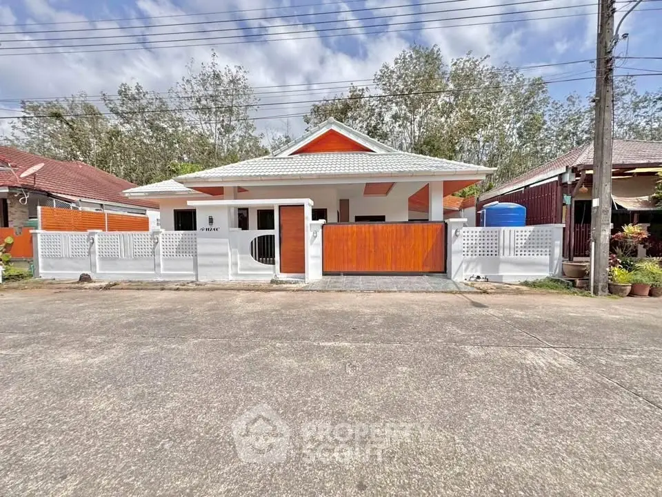 Charming single-story house with modern design and spacious front yard in a serene neighborhood.