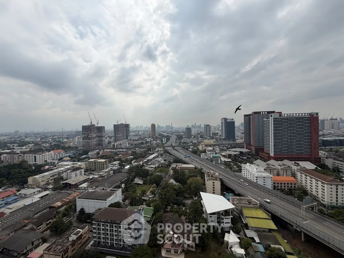 Stunning cityscape view showcasing urban skyline and highway, perfect for real estate investment.