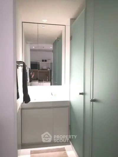 Modern bathroom with sleek design and frosted glass doors