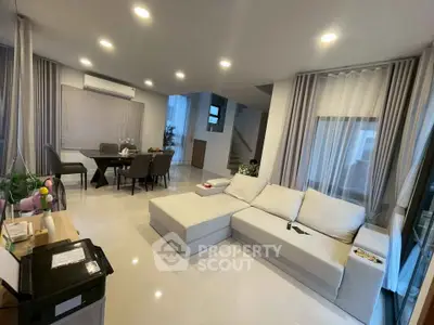 Spacious modern living room with elegant dining area and cozy sectional sofa