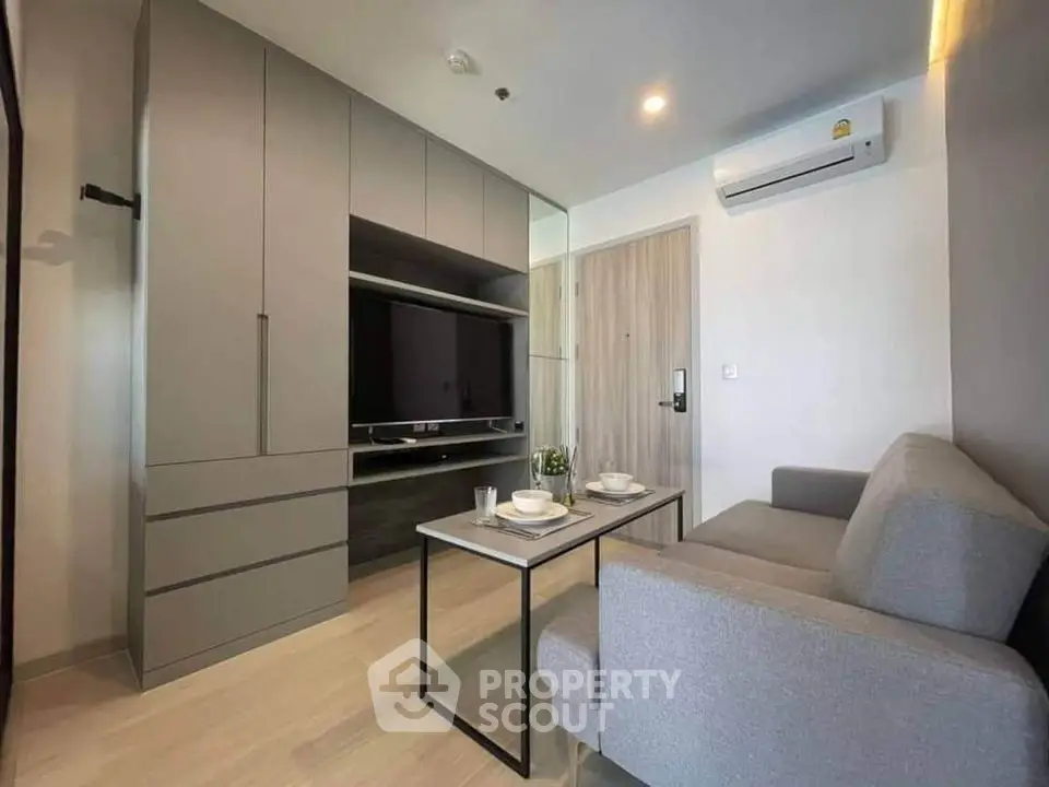 Modern living room with sleek furniture and built-in storage