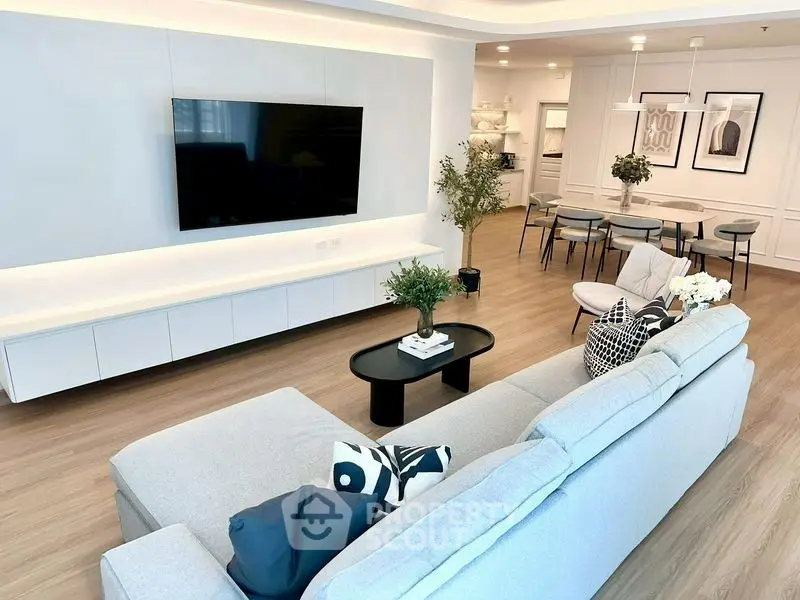 Spacious modern living room with stylish decor and open layout, perfect for entertaining.