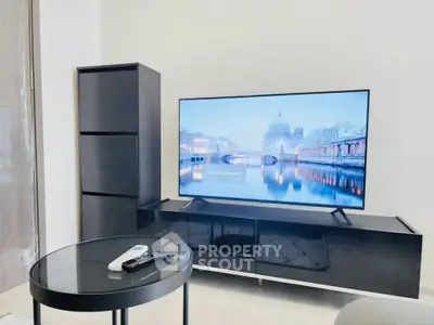 Modern living room with sleek TV setup and stylish furniture