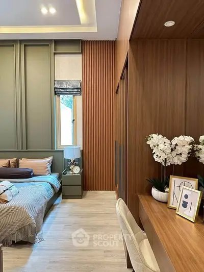 Stylish bedroom with modern decor, wooden accents, and cozy ambiance, perfect for relaxation and comfort.