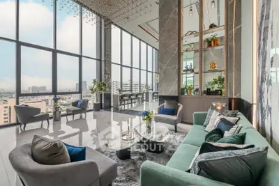 Luxurious high-rise living room with panoramic city views and elegant decor.