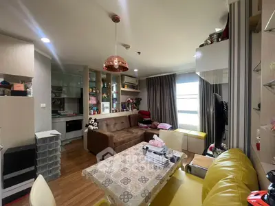 Cozy living room with modern decor and ample natural light