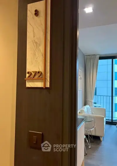 Modern apartment entrance with stylish interior and balcony view