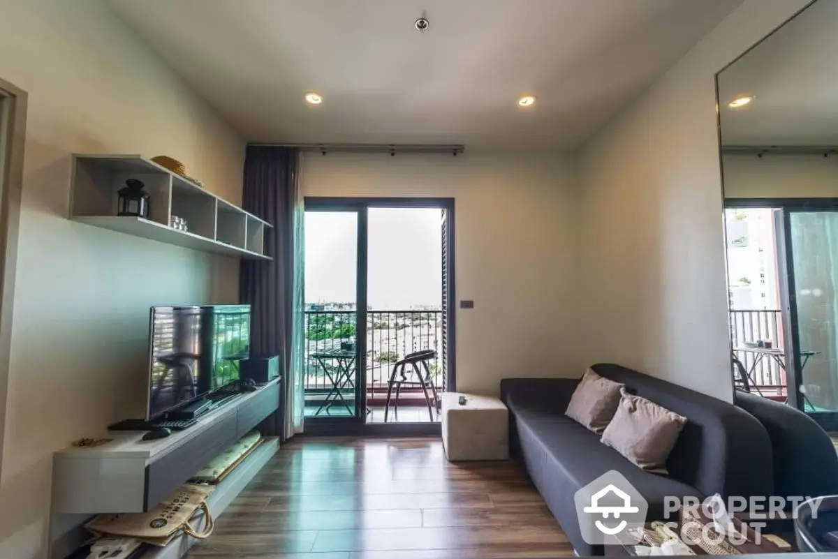 Modern living room with balcony view and sleek furnishings