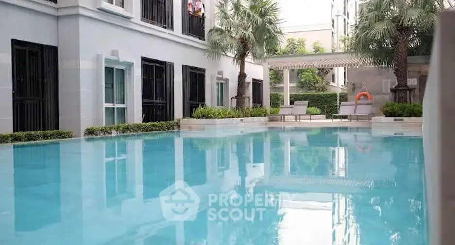 Luxurious residential pool area with modern design and lush greenery