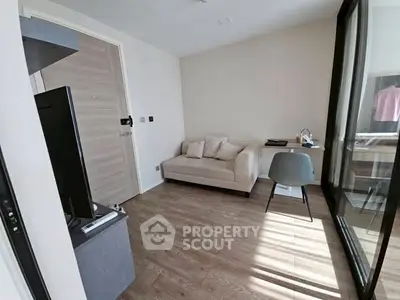 Modern study room with cozy sofa and desk, perfect for productivity.