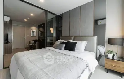 Modern bedroom with stylish decor and cozy ambiance in a contemporary apartment.