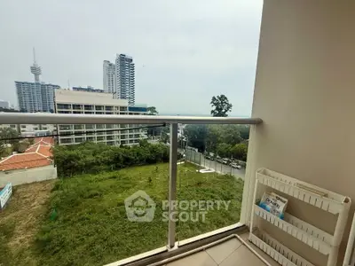Spacious balcony with city view in modern high-rise apartment