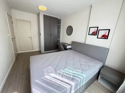 Modern bedroom with stylish decor and ample natural light