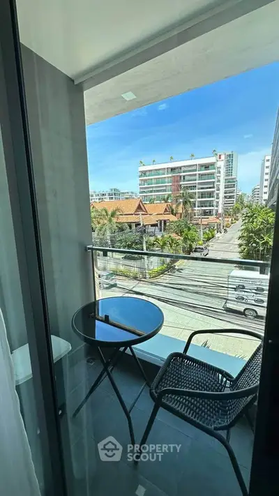 Charming balcony with city view, perfect for relaxing and enjoying the urban landscape.