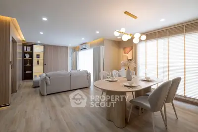 Spacious modern living room with elegant dining area and natural light