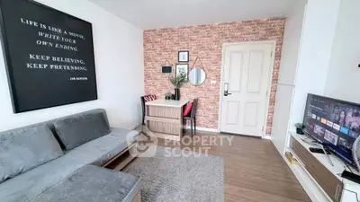 Chic living room with modern decor, exposed brick wall, and cozy seating area.