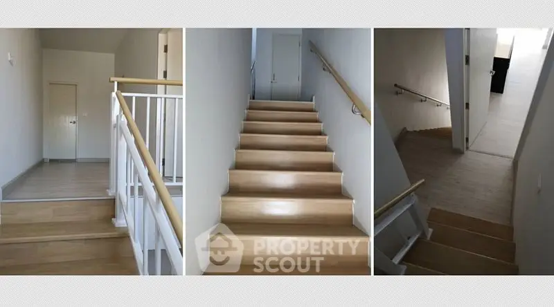Modern staircase with wooden steps and sleek handrails in a contemporary home interior.