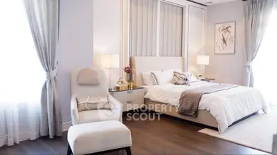 Luxurious bedroom with elegant decor and natural light