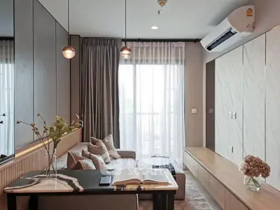 Modern living room with stylish decor and large window view
