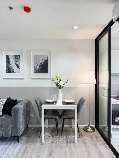 Modern living room with elegant dining area and stylish decor in a contemporary apartment.