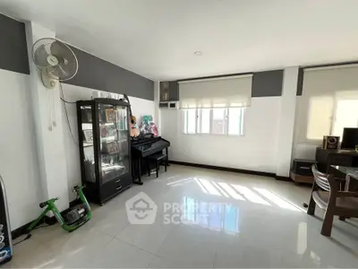 Spacious living room with natural light and modern decor